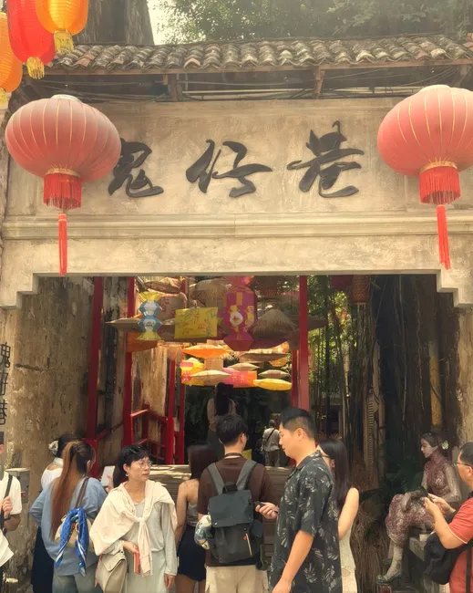 The lantern-hung gate at Kwai Chai Hong, Kuala Lumpur, on the ORIGINAL look: daylight colour, nothing added.